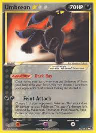 "Espeon and Umbreon Gold Star cards from POP Series 5 with shimmering holographic borders."